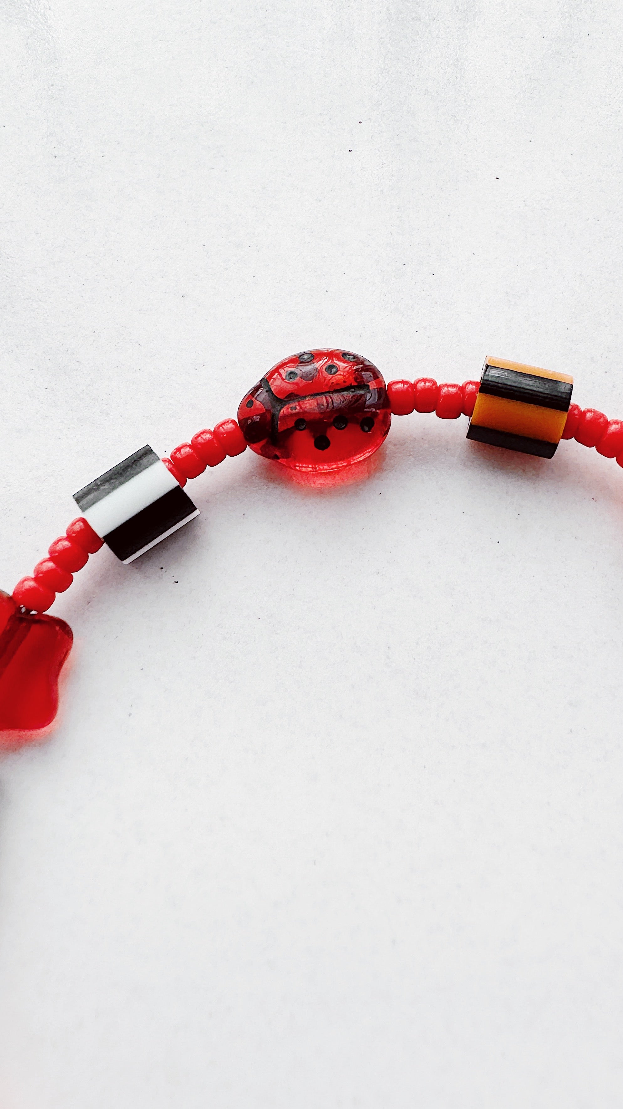 Critter Bracelet - red ladybug - flame / white