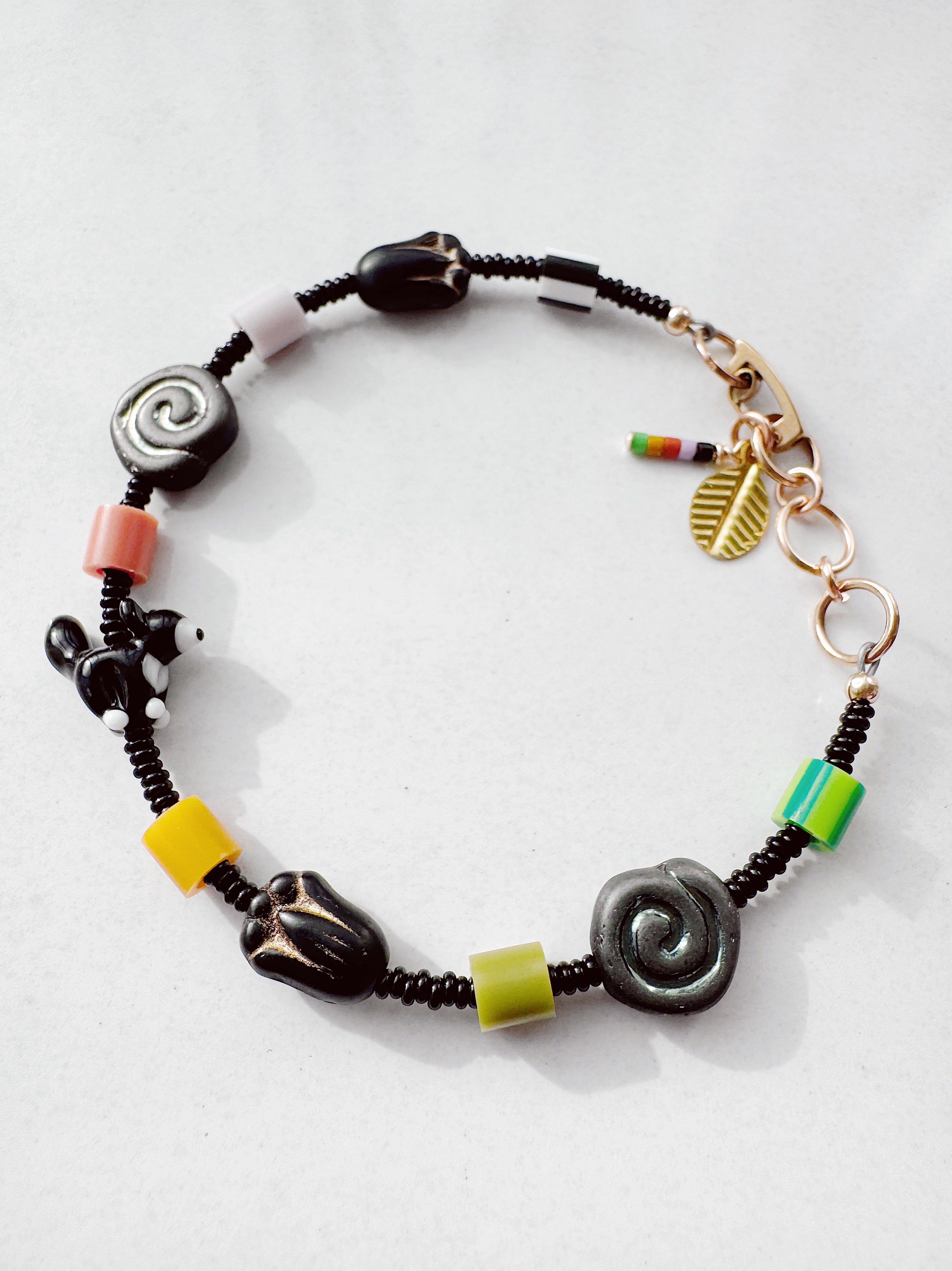 Critter Bracelet - black tuxie kitty - zebra / grass