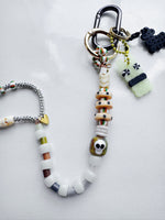 Load image into Gallery viewer, XXXL Long Bag Charm - green swirl skull + surprise!
