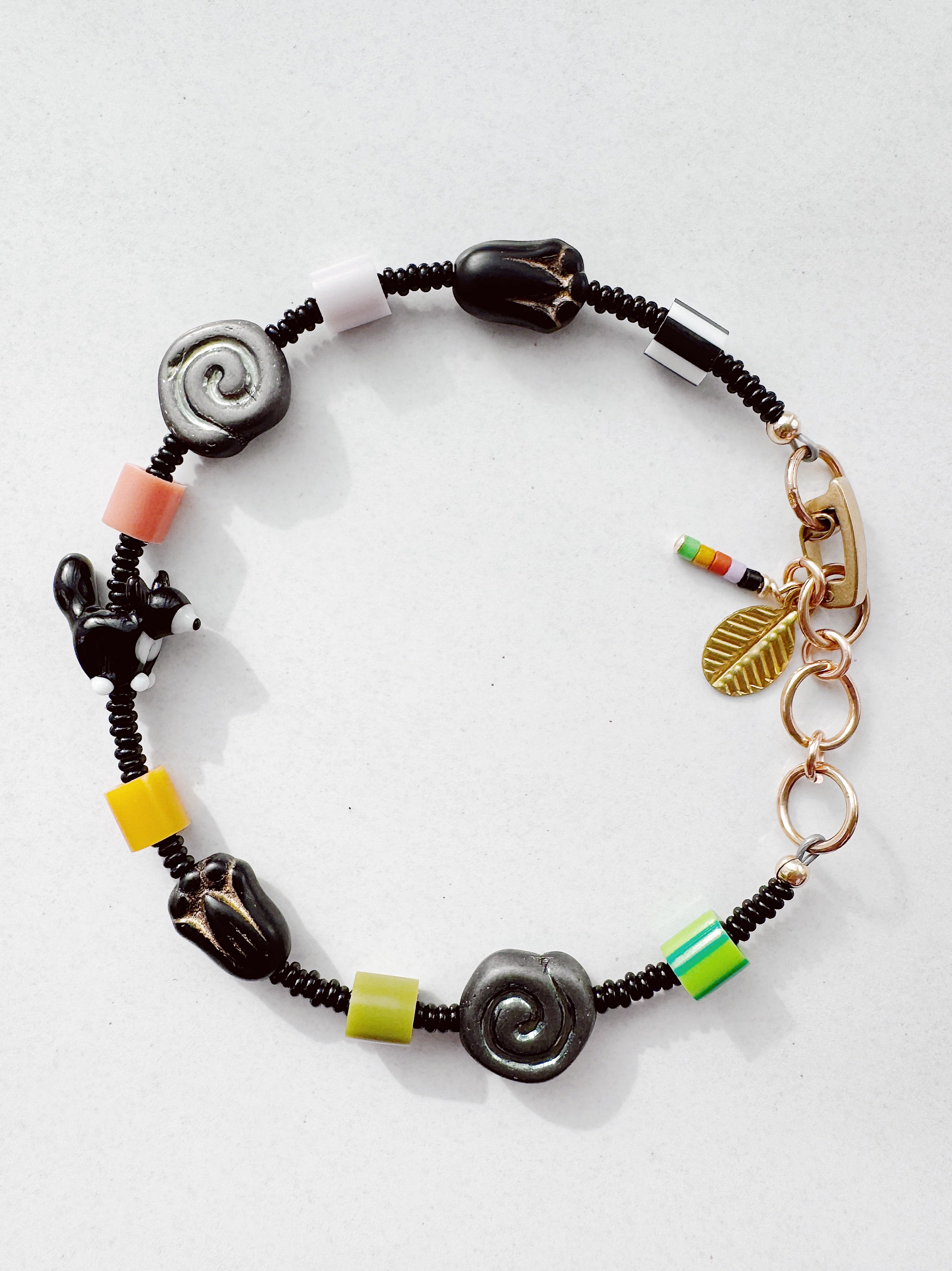 Critter Bracelet - black tuxie kitty - zebra / grass