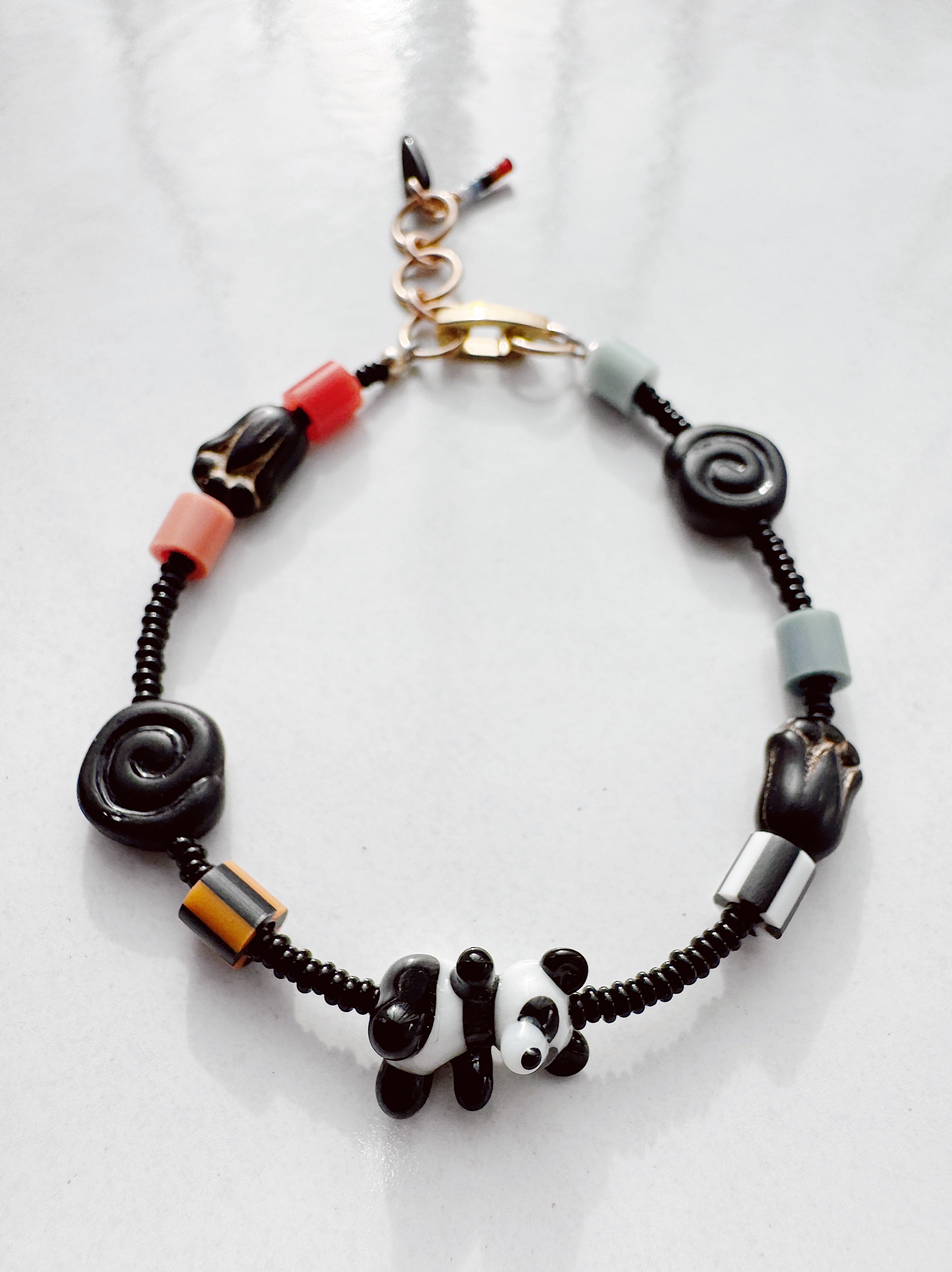 Critter Bracelet - black panda - dusk / red