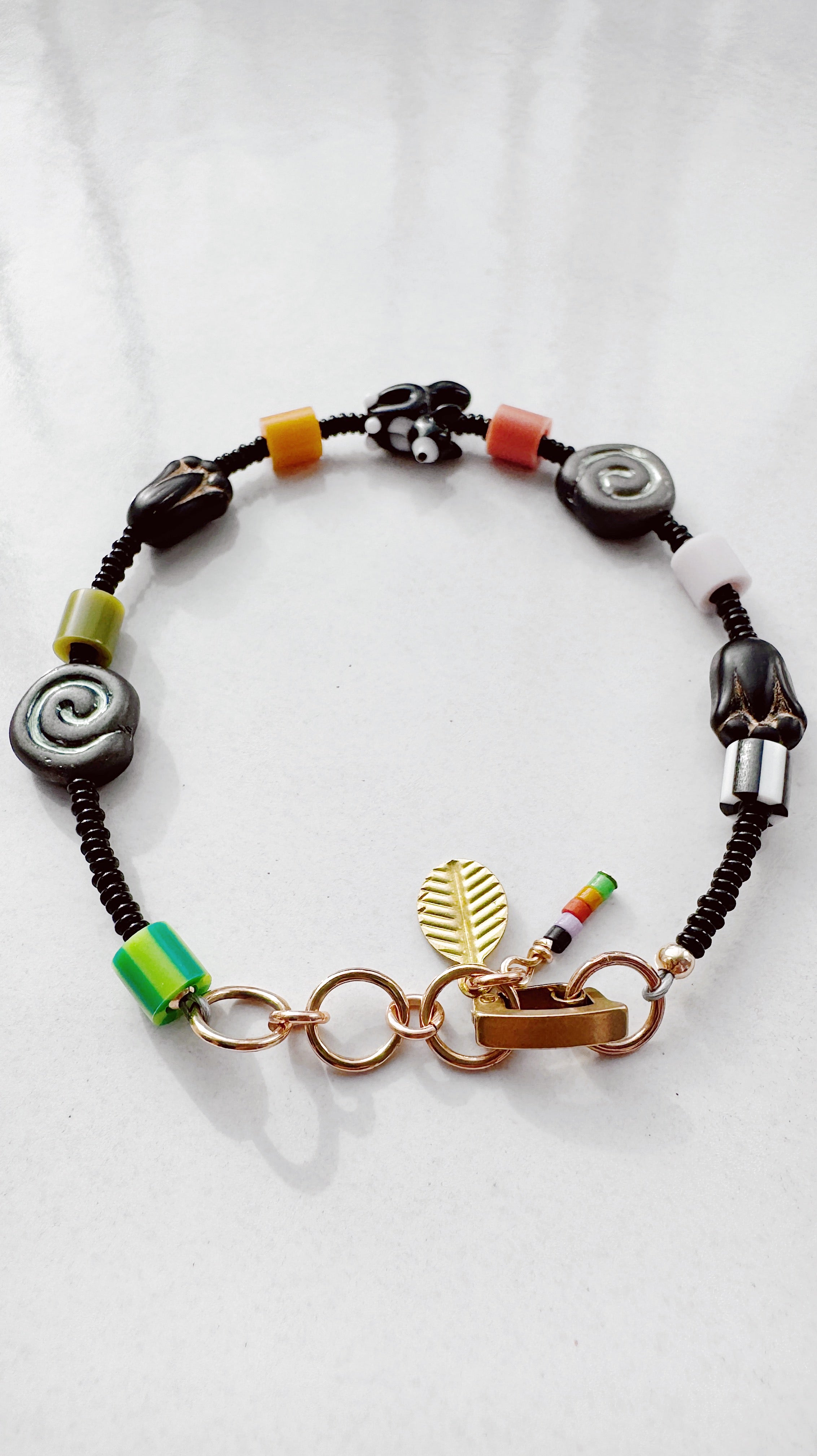 Critter Bracelet - black tuxie kitty - zebra / grass