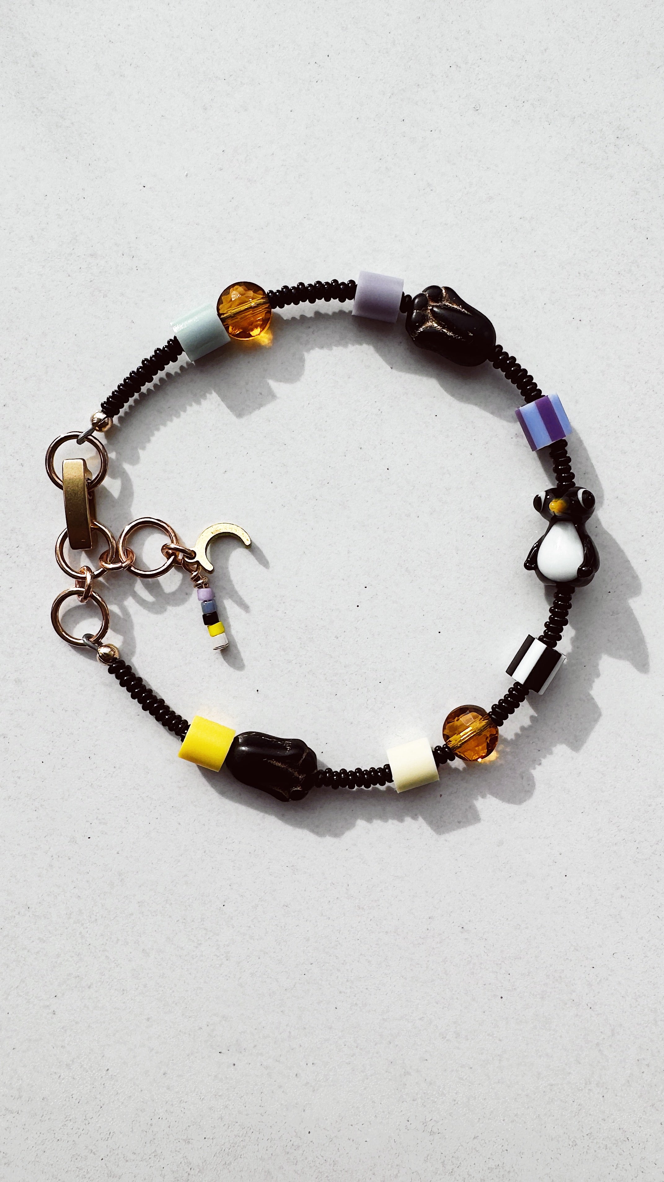 Critter Bracelet - black penguin - dusk / yellow