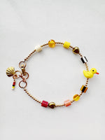 Load image into Gallery viewer, Golden Critter Bracelet - yellow duck - brick / moon
