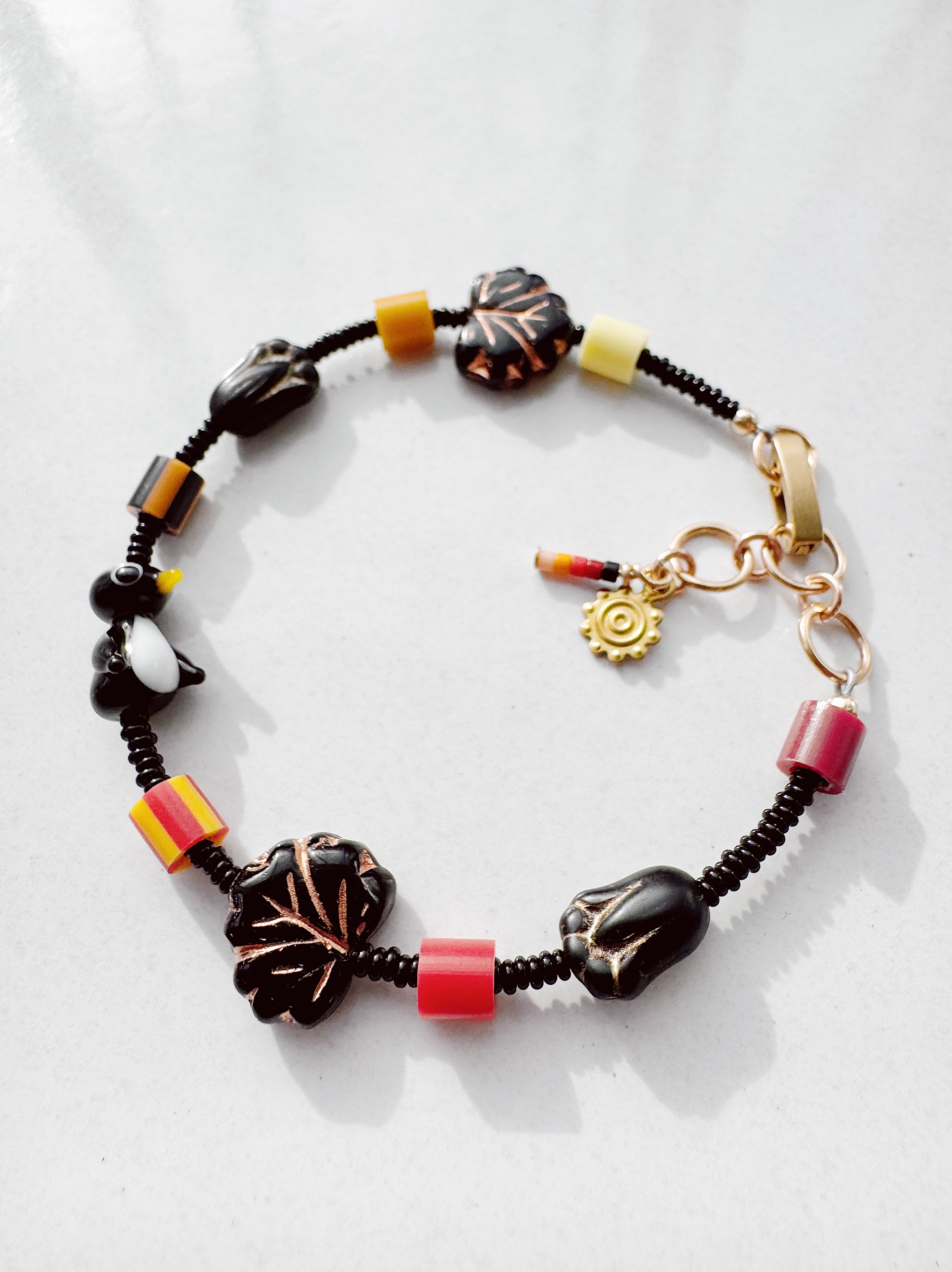 Critter Bracelet - black penguin - brick / lemon