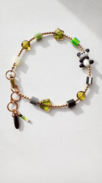Load image into Gallery viewer, Golden Critter Bracelet - panda - glow / grey
